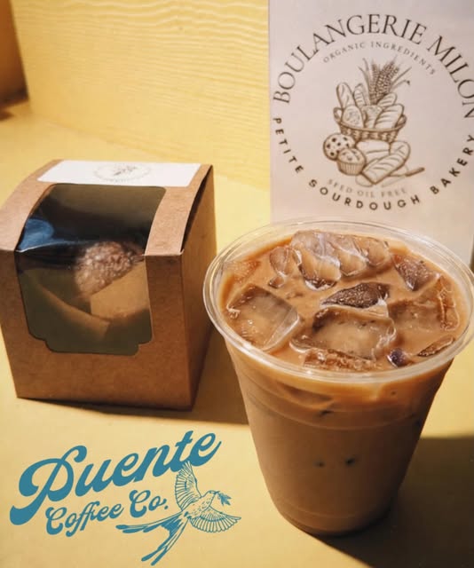 Iced coffee and a pastry box at Puente Coffee Co.