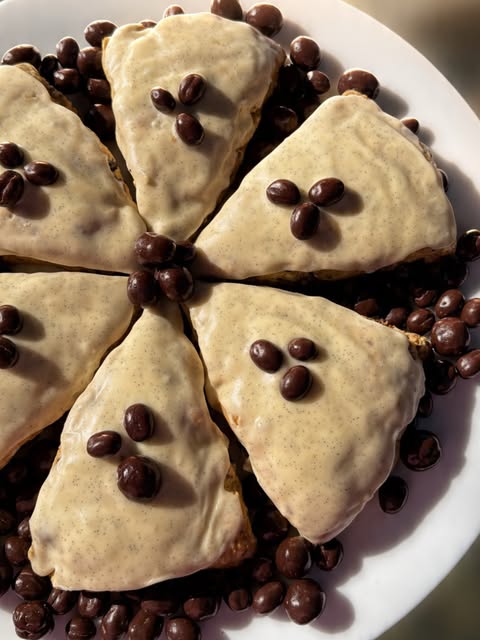 Glazed scones topped with chocolate.